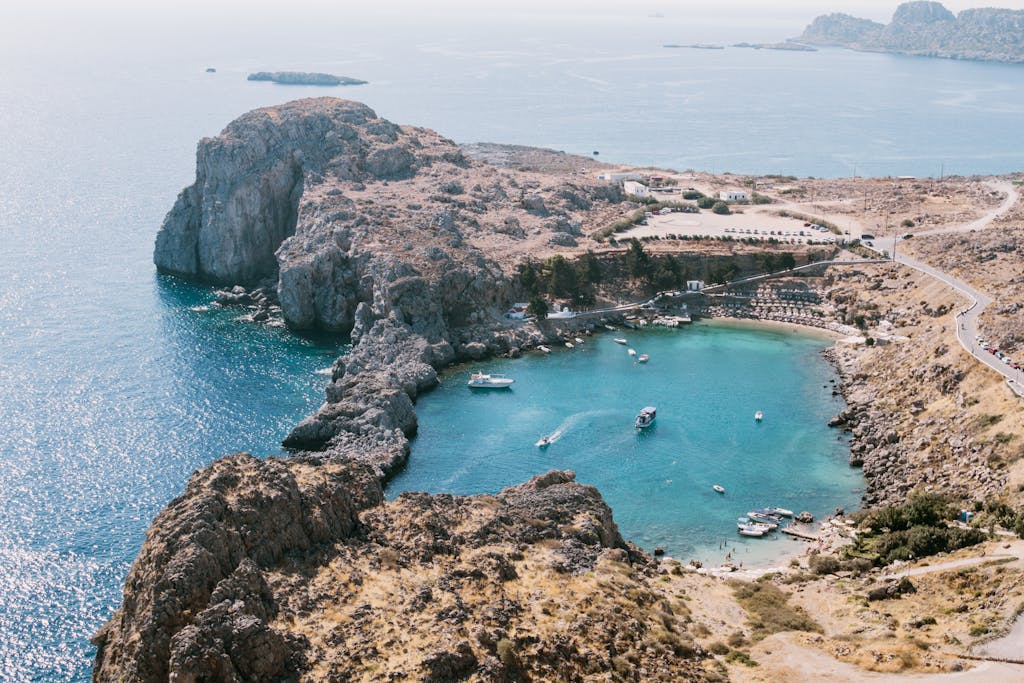 Breathtaking aerial view of Lindos Bay, capturing stunning landscapes and clear waters in Greece.