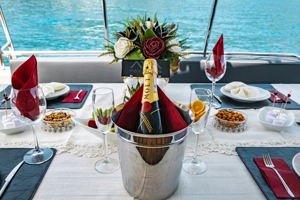 Luxurious dining setup with champagne on a boat overlooking the sea in Antalya, Türkiye.